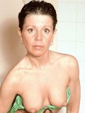 Hot mama shows her boobs and sexy bumps in the shower room. See how she grabs her tits?