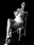 Artful black-and-white pics of big-tittied older seductress posing in lingerie