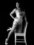 Artful black-and-white pics of big-tittied older seductress posing in lingerie