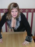 Sexy cougar with very big tatas boasting of the cleavage as deep as Grand Canyon