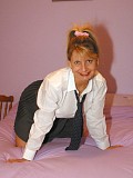 Naughty blonde housewife posing in a shirt and tie with nothing to hide her trimmed pussy