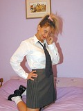 Naughty blonde housewife posing in a shirt and tie with nothing to hide her trimmed pussy