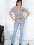 Even most usual outfits like jeans and knit top start looking kinky on this MILF