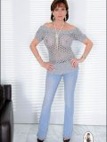 Even most usual outfits like jeans and knit top start looking kinky on this MILF