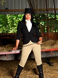 Sexy horse riding brunette Danica loves to tease her trimmed pussy with a horsewhip