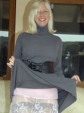 Sassy blonde mature milf takes her clothes off to reveal her sexy black stockings