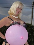 Kinky blonde housewife shows her juicy ass in stockings while playing with a balloon