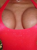 This brunette babes tits nearly explode out of her tight and tiny pink dress